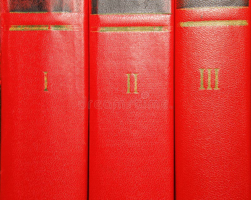 Volumes of old books with gold lettering on the cover