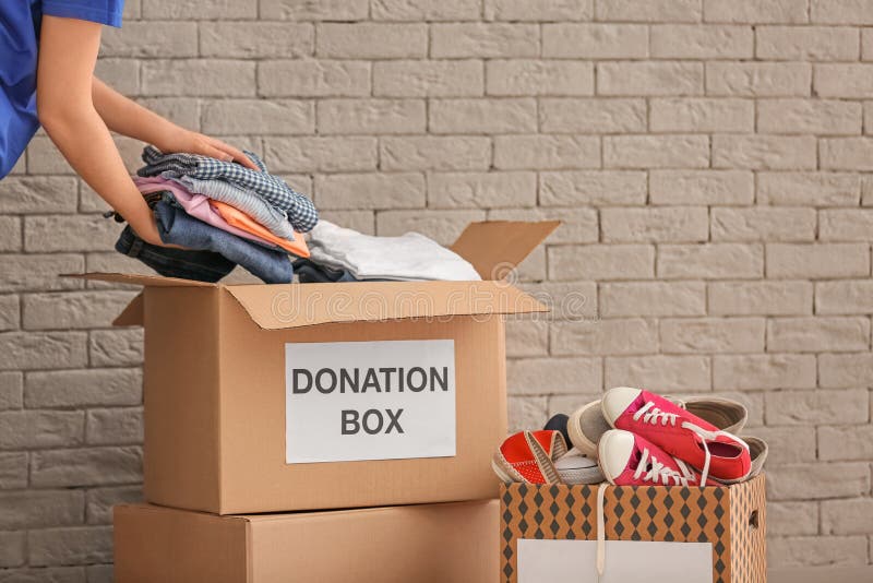 Premium Photo  Empty donate box on chair against wall