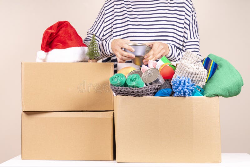 Filling a Shoebox with charitable donations Christmas in great Britain.