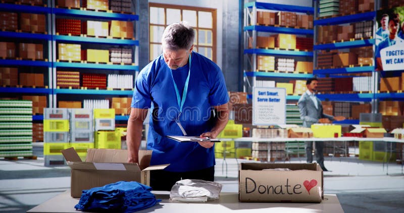 Volunteer Sorting Clothes. Humanitarian Care Refugee Assistance. Charity sorting stock images, royalty-free photos and pictures