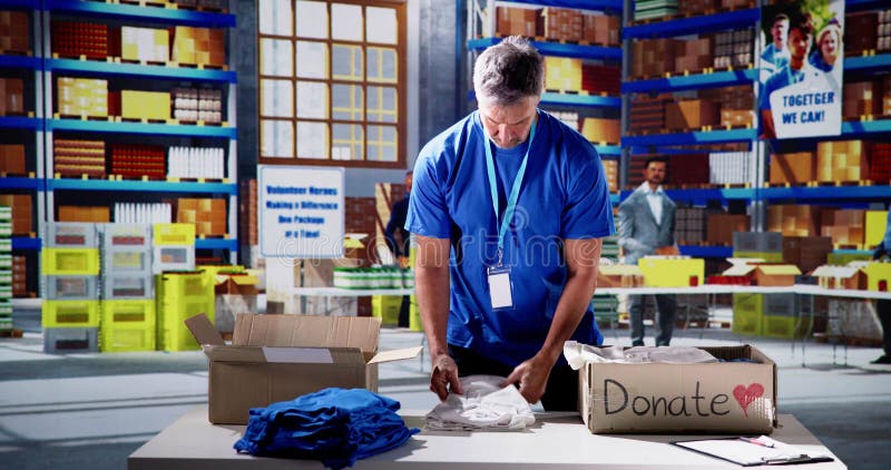 Volunteer Sorting Clothes. Humanitarian Care Refugee Assistance. Charity sorting stock images, royalty-free photos and pictures