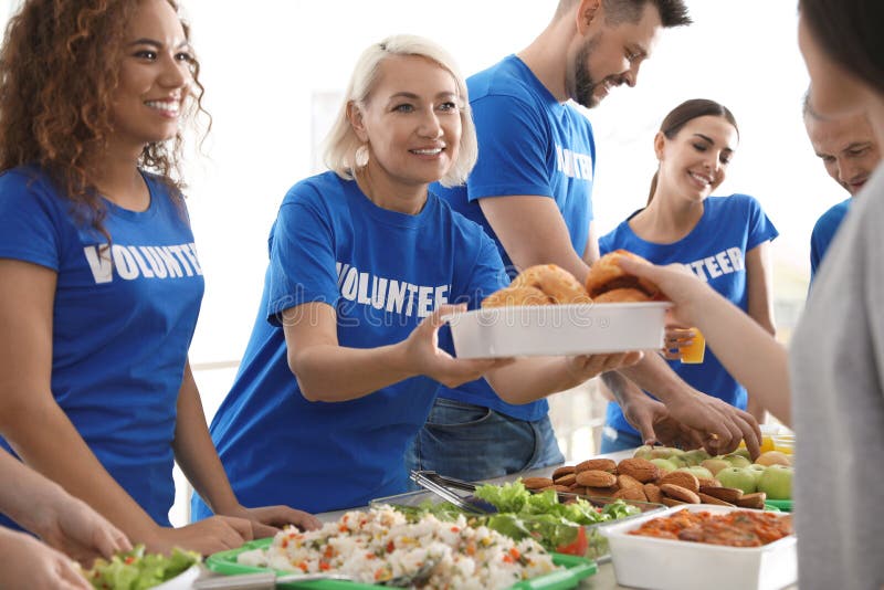 Volunteers serving food to poor people royalty free stock image Volunteers serving food to poor people royalty free stock image