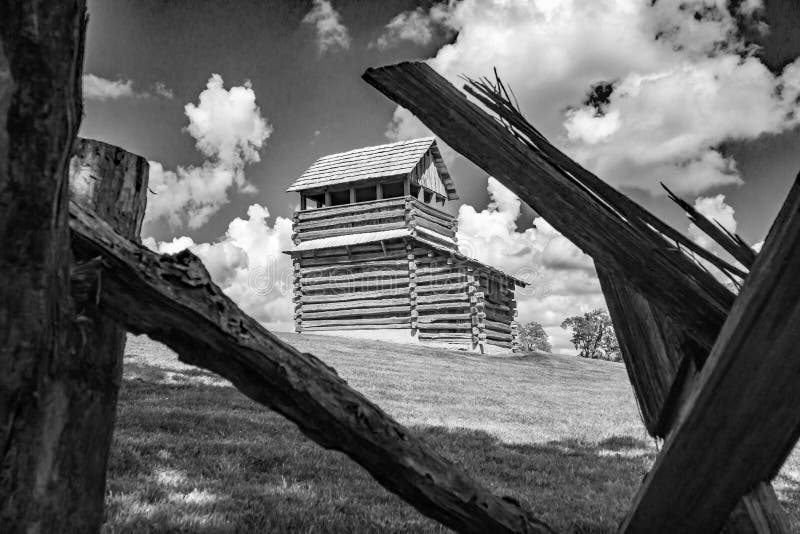Floyd County, Virginia USA – September 20th: A black and white image of the lookout tower framed with a buck rail fence in the foreground with blue skies and white clouds in the background at the Groundhog Mountain picnic area on the Blue Ridge Parkway on September 20th, 2017, Floyd County, Virginia, USA. Floyd County, Virginia USA – September 20th: A black and white image of the lookout tower framed with a buck rail fence in the foreground with blue skies and white clouds in the background at the Groundhog Mountain picnic area on the Blue Ridge Parkway on September 20th, 2017, Floyd County, Virginia, USA.