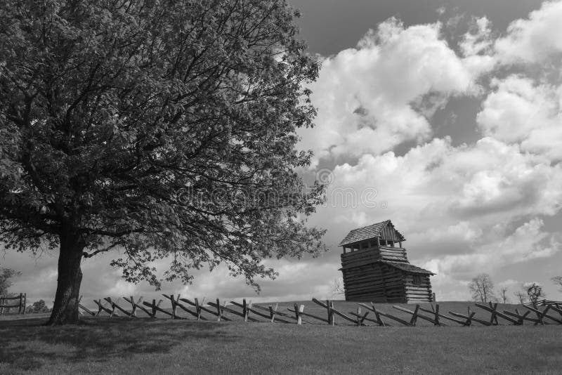 Floyd County, Virginia USA - May 19: View of the lookout tower with buck fence in the foreground on Groundhog Mountain picnic area on the Blue Ridge Parkway on May 19, 2014, Floyd County, Virginia, USA. Floyd County, Virginia USA - May 19: View of the lookout tower with buck fence in the foreground on Groundhog Mountain picnic area on the Blue Ridge Parkway on May 19, 2014, Floyd County, Virginia, USA.