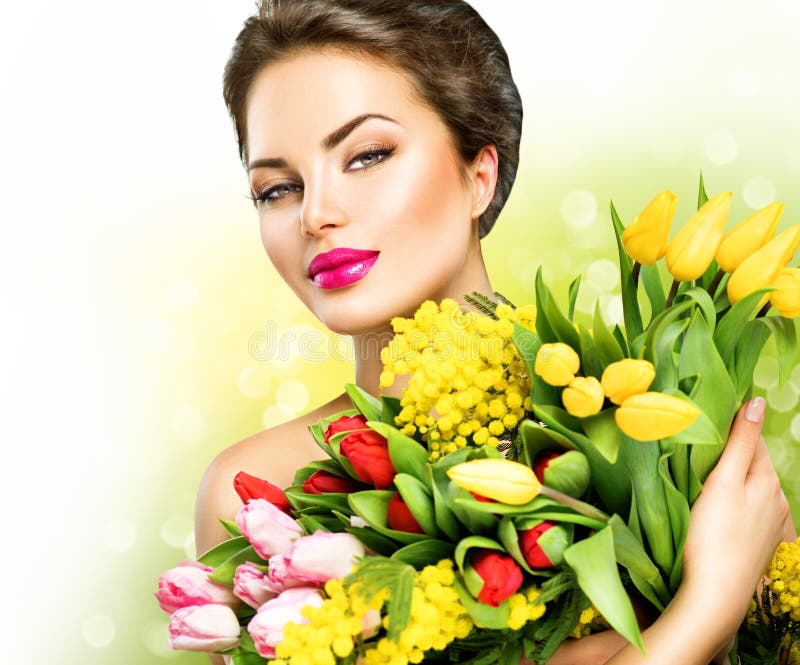 Vorbildliche Frau der Schönheit mit Frühlingsblumen stockfoto Vorbildliche Frau der Schönheit mit Frühlingsblumen stockfoto