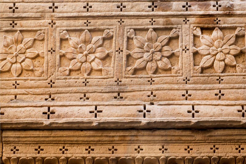 Vorm van bloemen op een oppervlakte van de steenmuur stock fotografie Vorm van bloemen op een oppervlakte van de steenmuur stock fotografie