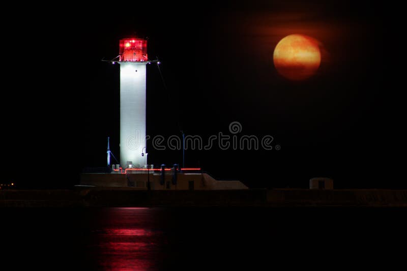 Vorontsov Lighthouse night against the rising of the big red moon. royalty free stock photo Vorontsov Lighthouse night against the rising of the big red moon. royalty free stock photo