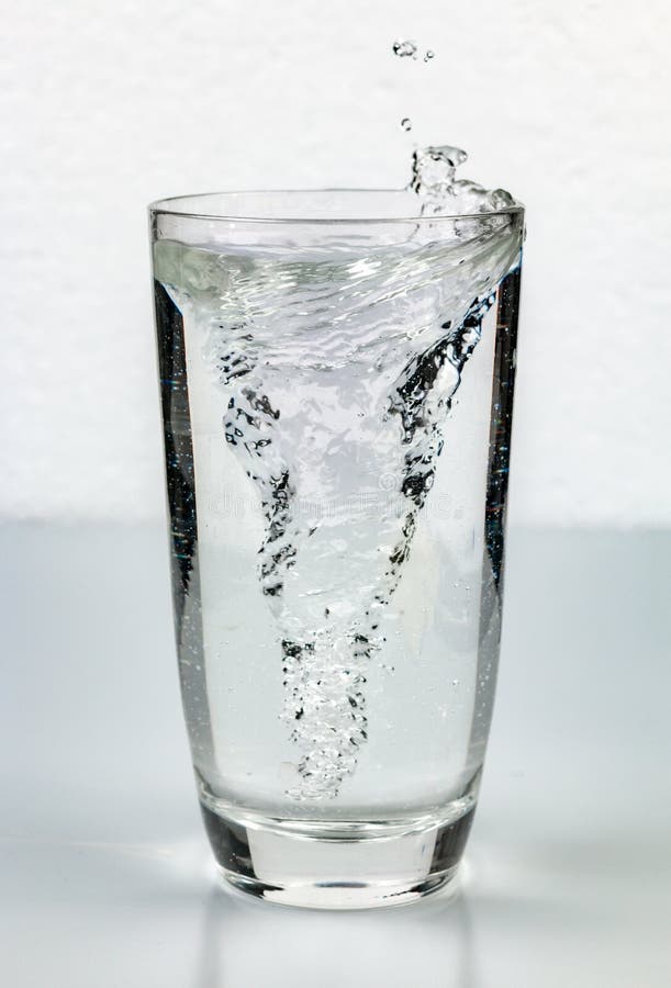 Whirlpool vortex in glass of water. Whirlpool vortex water stock images, royalty-free photos and pictures