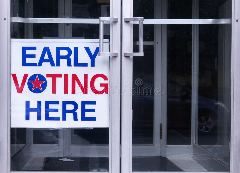 An early voting sign on a door welcoming people to vote for an democratic election in the united states of america. An early voting sign on a door welcoming people to vote for an democratic election in the united states of america