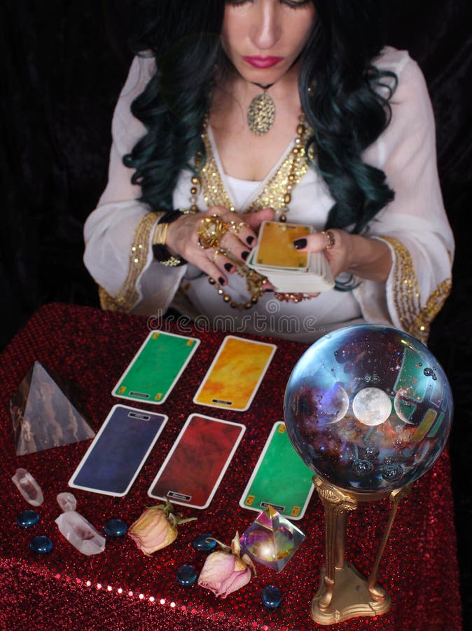 Psychic with green hair  Crystal Ball. and tarot cards, Shallow DOF Focus on Crystal Ball. Psychic with green hair  Crystal Ball. and tarot cards, Shallow DOF Focus on Crystal Ball