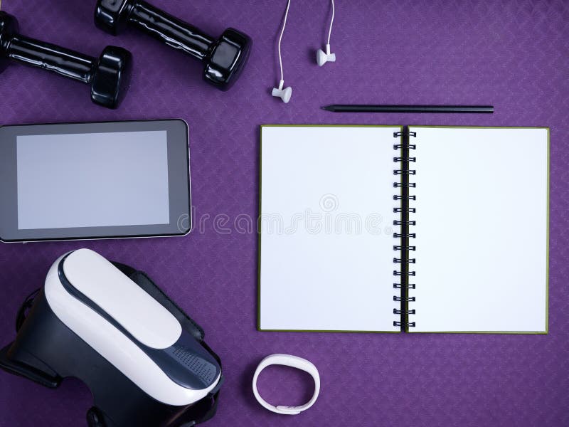 VR glasses, fitness stuff, tablet PC and notebook with pen stock photo VR glasses, fitness stuff, tablet PC and notebook with pen stock photo