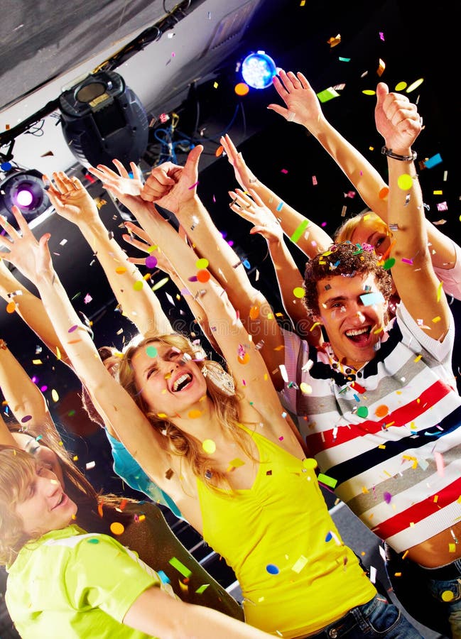 Photo of excited teenagers raising their arms in joy. Photo of excited teenagers raising their arms in joy