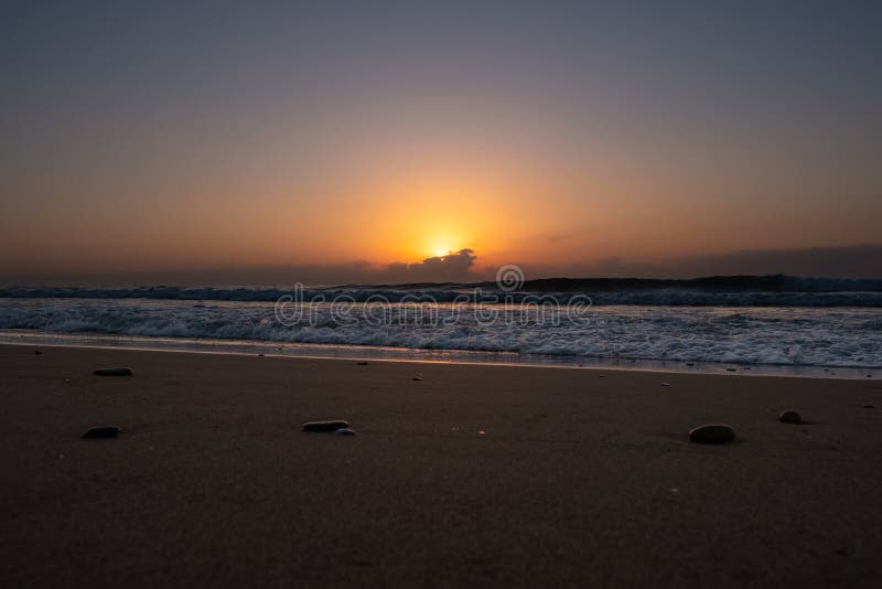 Beautiful early dawn on the sea beach with soft waves. Beautiful early dawn on the sea beach with soft waves