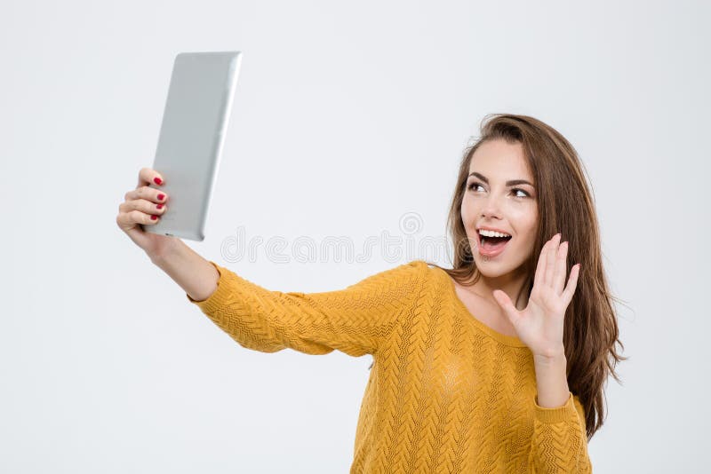 Vrolijke vrouw die videovraag op tabletcomputer doen stock afbeeldingen Vrolijke vrouw die videovraag op tabletcomputer doen stock afbeeldingen