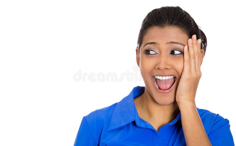 Closeup portrait of a happy young pretty woman looking to left shocked and surprised in full disbelief hand on cheek, isolated on white background. Positive human emotion facial expression feeling. Closeup portrait of a happy young pretty woman looking to left shocked and surprised in full disbelief hand on cheek, isolated on white background. Positive human emotion facial expression feeling