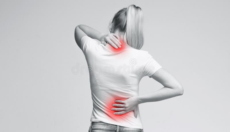 Woman with neck and back pain, rubbing her painful body, back view, panorama. Woman with neck and back pain, rubbing her painful body, back view, panorama