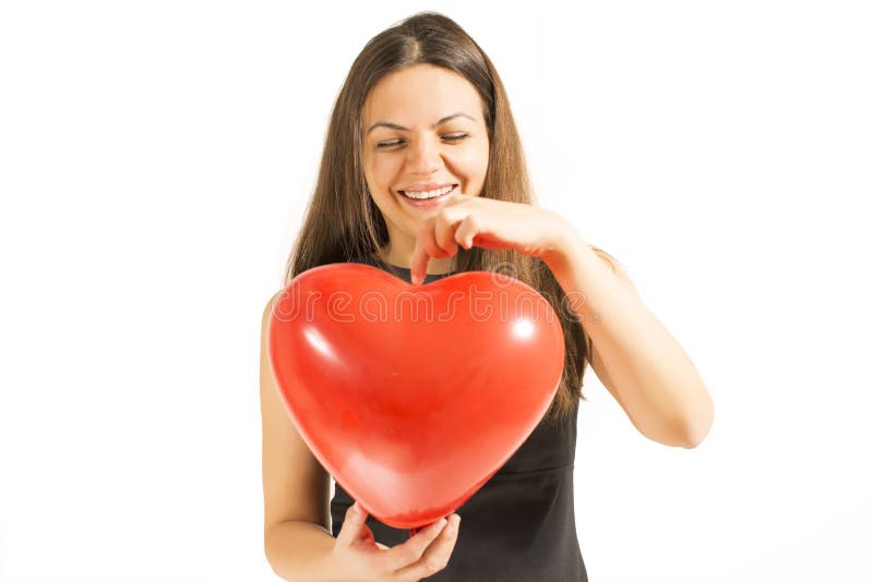 Vrouw die rode hartballon houden stock afbeelding Vrouw die rode hartballon houden stock afbeelding