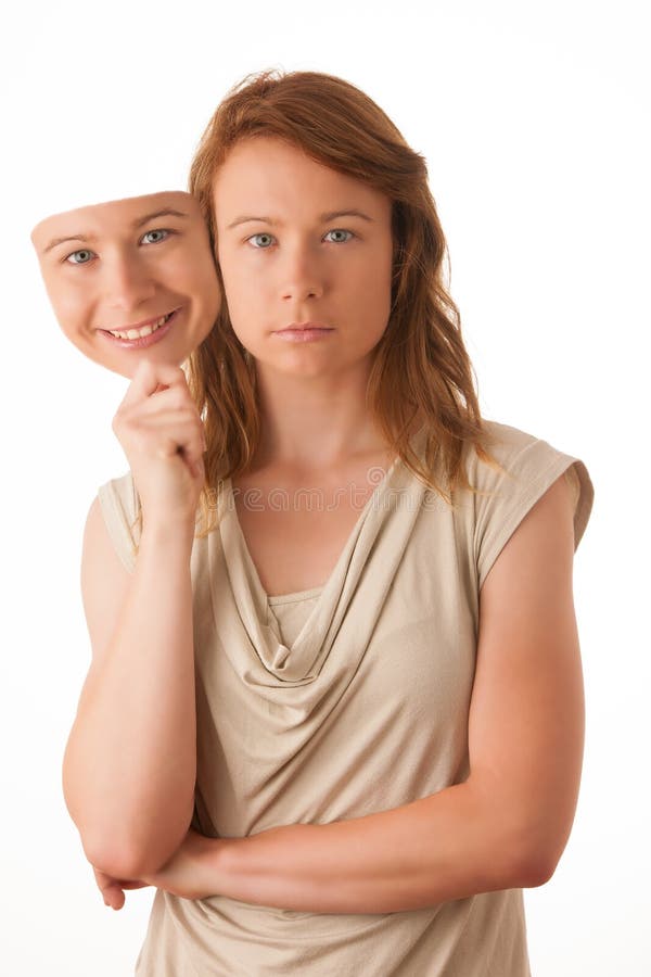 Vrouw het verbergen onder het gelukkige masker. stock foto Vrouw het verbergen onder het gelukkige masker. stock foto