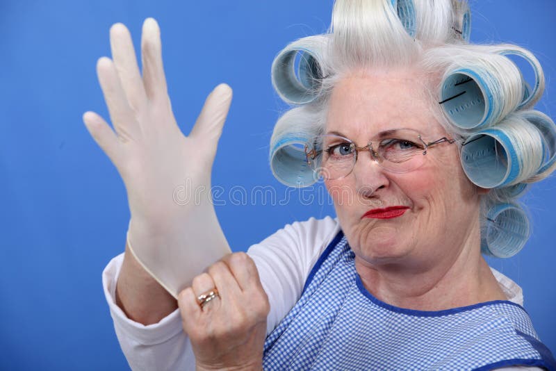 Senior woman with hair curlers. Senior woman with hair curlers