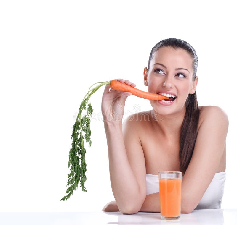 Funny young woman with the carrots juice. Funny young woman with the carrots juice