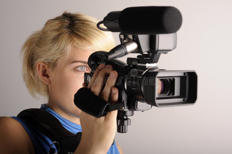 Vrouw met videocamera royalty-vrije stock afbeeldingen Vrouw met videocamera royalty-vrije stock afbeeldingen
