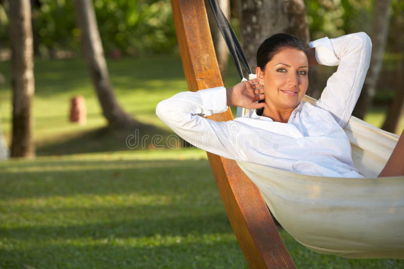 20-25 years woman portrait ralaxing on hammock at exotic surrounding, bali indonesia. 20-25 years woman portrait ralaxing on hammock at exotic surrounding, bali indonesia