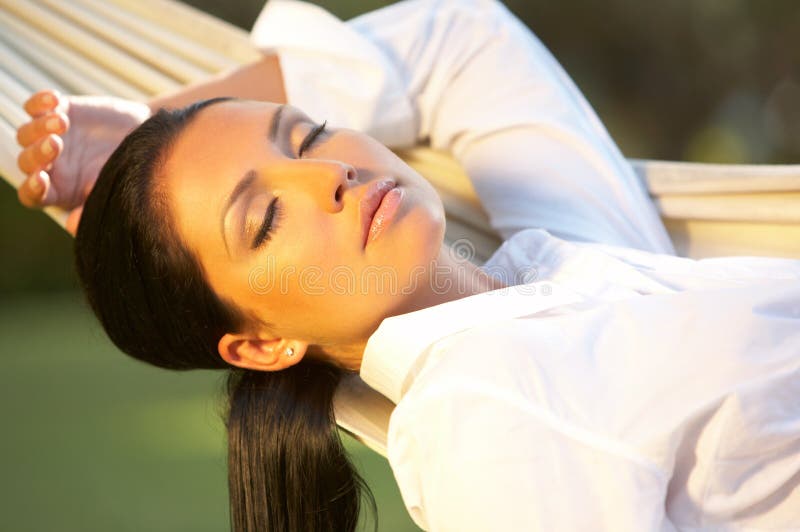 20-25 years woman portrait ralaxing on hammock at exotic surrounding, bali indonesia. 20-25 years woman portrait ralaxing on hammock at exotic surrounding, bali indonesia