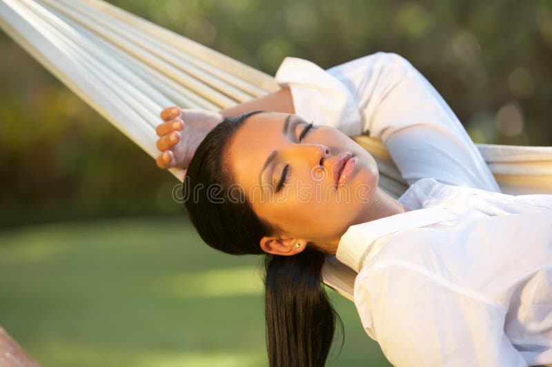 20-25 years woman portrait ralaxing on hammock at exotic surrounding, bali indonesia. 20-25 years woman portrait ralaxing on hammock at exotic surrounding, bali indonesia