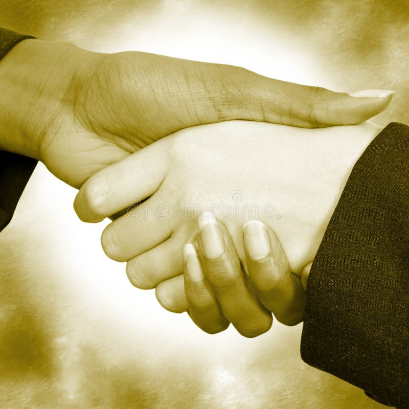 Two woman shaking hands. Business suit sleeves. Two woman shaking hands. Business suit sleeves.