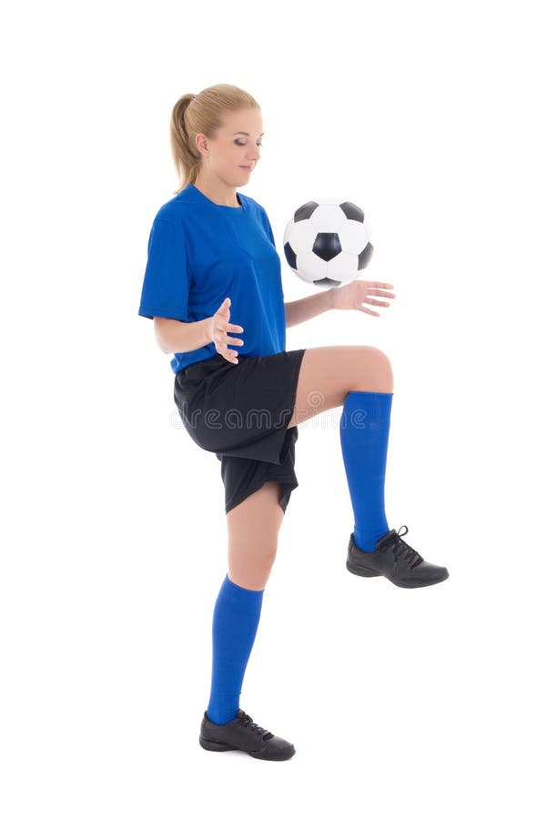 Young female soccer player in blue uniform playing with ball isolated on white background. Young female soccer player in blue uniform playing with ball isolated on white background