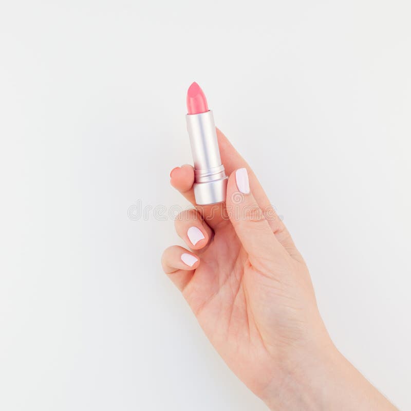 Vrouwenhand met roze lippenstift royalty-vrije stock fotografie