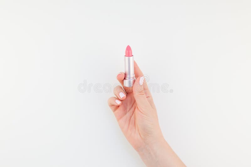 Vrouwenhand met roze lippenstift royalty-vrije stock foto's