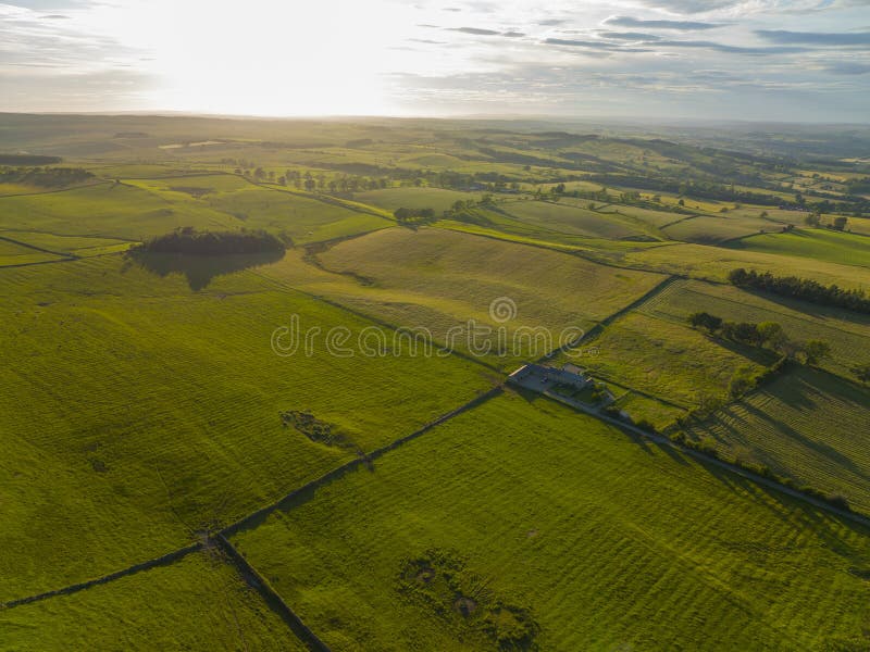 Aerial view of Northumberland countryside near Hadrian's Wall ruin at village of Chollerford in town of Hexham in England, UK. Aerial view of Northumberland countryside near Hadrian's Wall ruin at village of Chollerford in town of Hexham in England, UK.