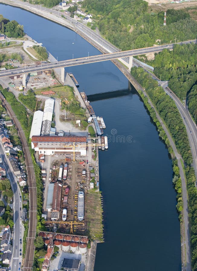 Aerial View : viaduct over a curved river near a shipyard. Aerial View : viaduct over a curved river near a shipyard