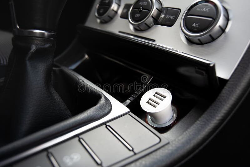 Automobile interior view with a phone charger. Two USB ports charger. Automobile interior view with a phone charger. Two USB ports charger.