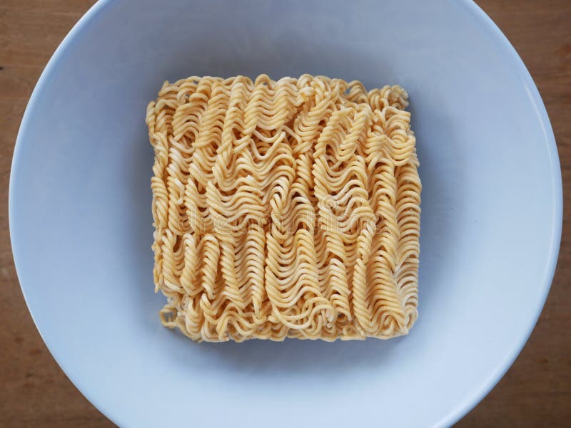 Dried instant noodle circle shape top view isolated on white background,ramen noodle,pasta. Dried instant noodle circle shape top view isolated on white background, clipping path included,pasta ,noodle, ramen