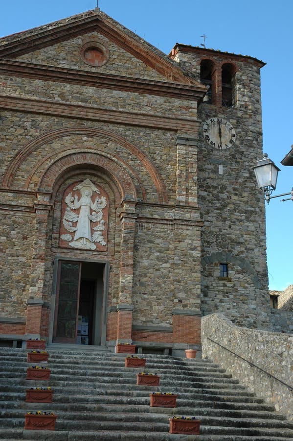 The basilica of Panzano in Chianti with its medieval tower in the historic center of the town and overlooking the territory of Panzano. The basilica of Panzano in Chianti with its medieval tower in the historic center of the town and overlooking the territory of Panzano.