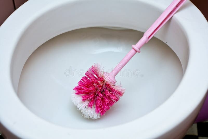 Dirty old toilet with pink ceramic tiles. Dirty old toilet with pink ceramic tiles