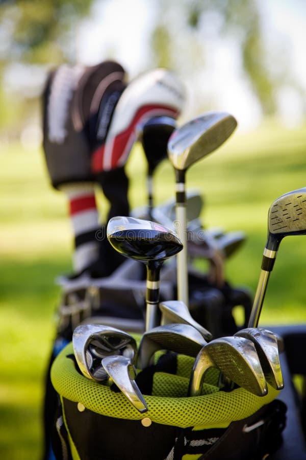 Dirty golf clubs in buggy, selective focus. Dirty golf clubs in buggy, selective focus