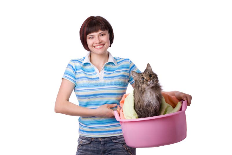 Housewife with laundry basket with dirty cat. A young woman holding a basket of folded laundry. Time for laundry day. Housewife with laundry basket with dirty cat. A young woman holding a basket of folded laundry. Time for laundry day.