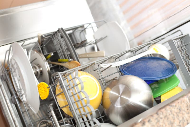 Dishwasher with dirty dishes (selective focus with shallow DOF). Dishwasher with dirty dishes (selective focus with shallow DOF)