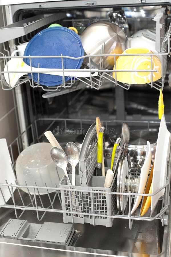 Dishwasher with dirty dishes (selective focus with shallow DOF). Dishwasher with dirty dishes (selective focus with shallow DOF)