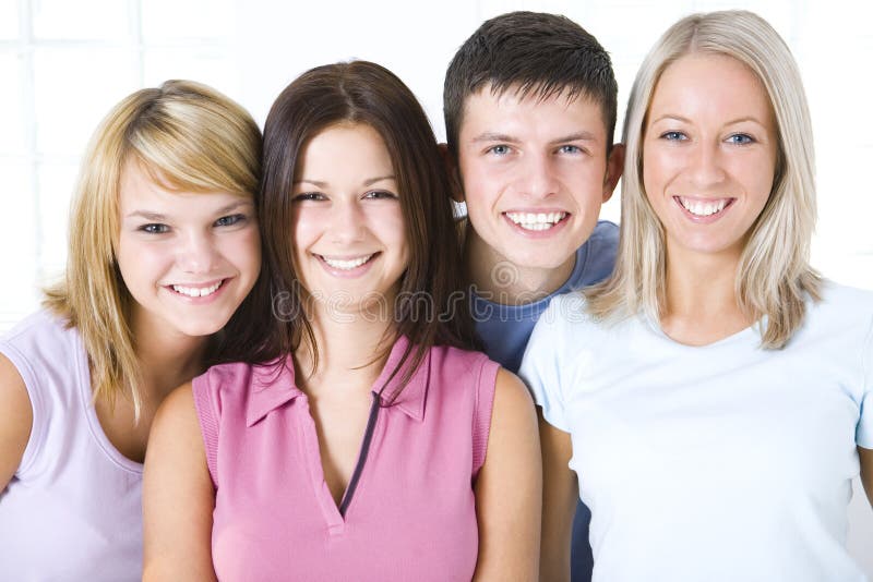 Group of smiling friends looking at camera. Closeup on faces. Front view. Group of smiling friends looking at camera. Closeup on faces. Front view.
