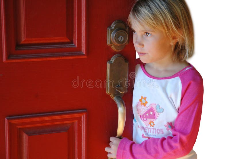 Young girl waits by the door for someone. Young girl waits by the door for someone.
