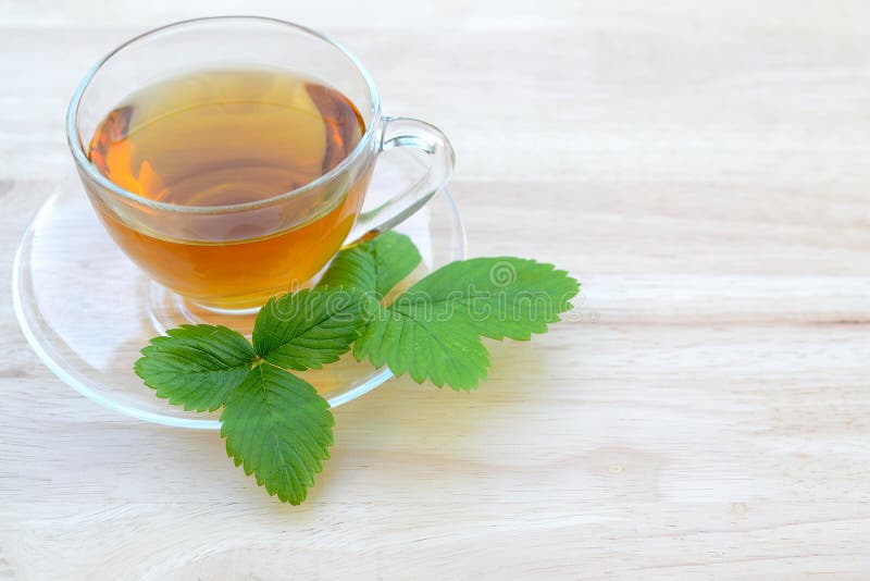 Herbal tea on a table. wild strawberries herbal tea on a table. Herbal tea on a table. wild strawberries herbal tea on a table.