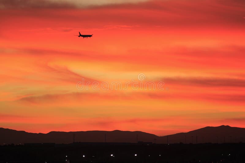Airplane landing at McCarran Airport in Las Vegas at sunset. Airplane landing at McCarran Airport in Las Vegas at sunset.