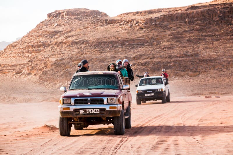 Bedouin`s Car Jeeps And Tourists In It In Wadi Rum Desert In Jordan