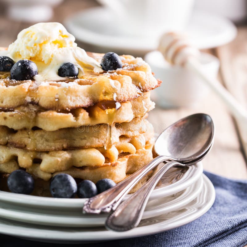 Waffles with blueberries and ice cream royalty free stock images