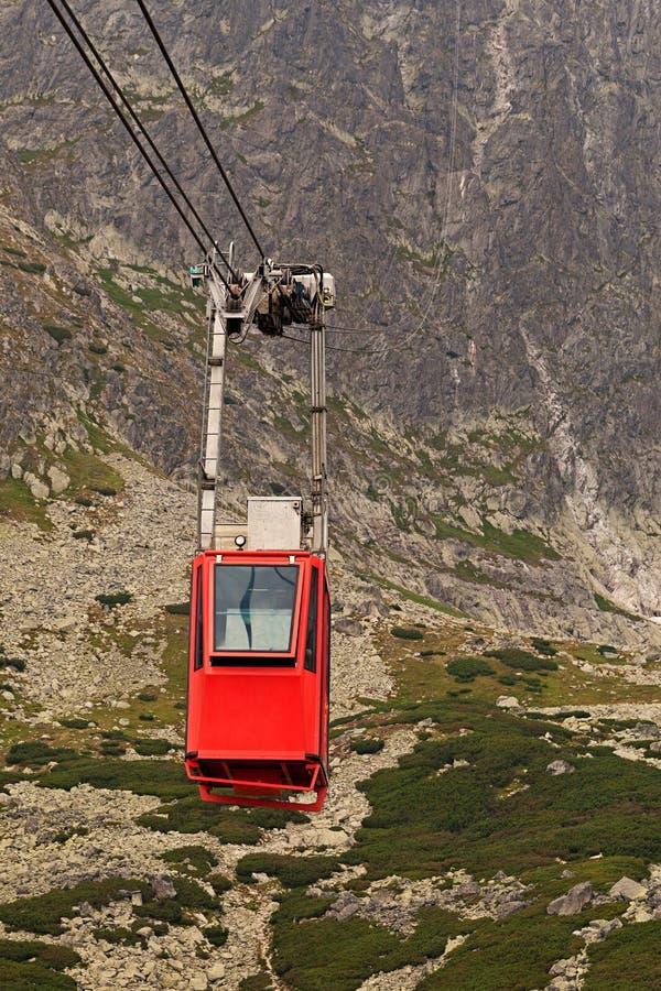 Wagon cable car against the background of beautiful rocky mountains