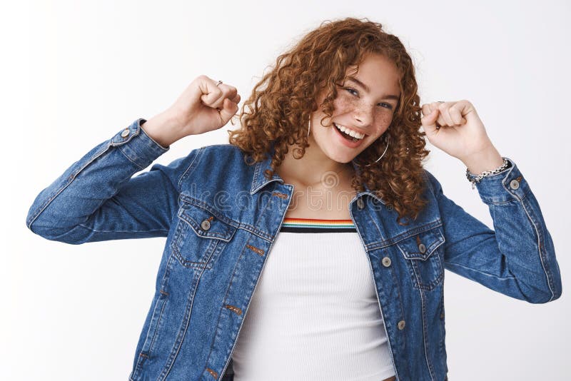 Premium Photo  Happy outgoing stylish ginger adolescent girl curly-haired  pimples holding smartphone playing phone game use funny app look you  devious joyfully smiling messaging talking you same time